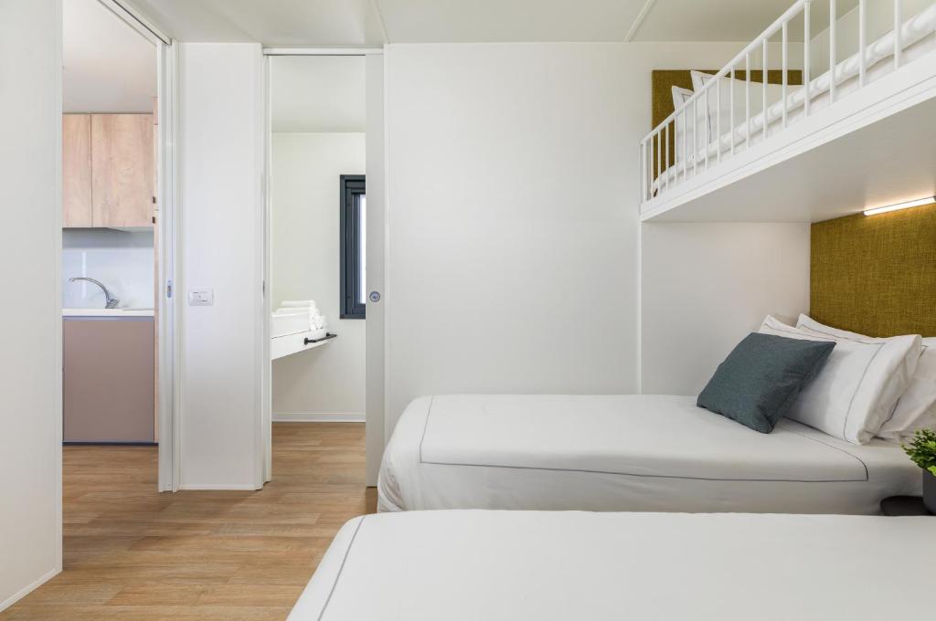 Posteľ alebo postele v izbe v ubytovaní Arena Stupice Camping Homes