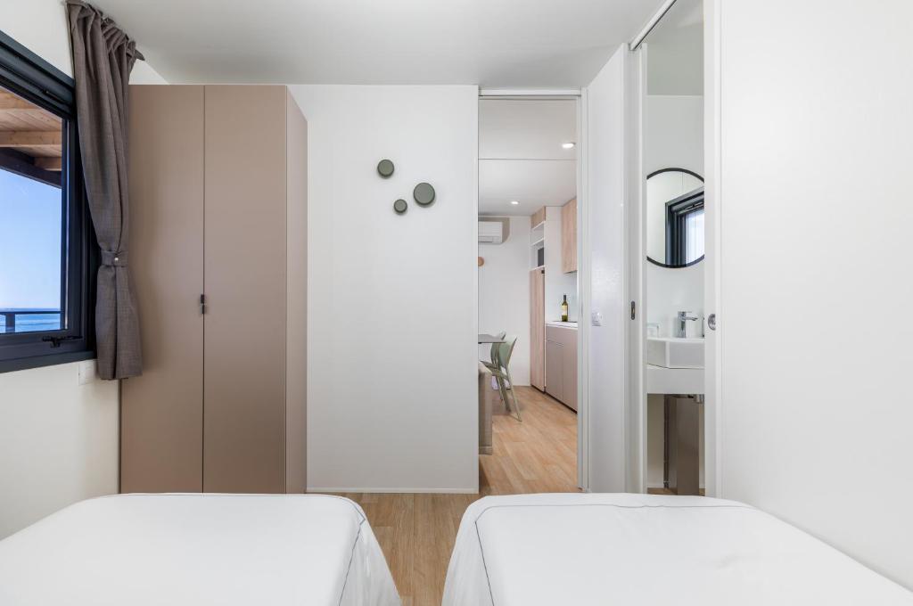 Posteľ alebo postele v izbe v ubytovaní Arena Stupice Camping Homes