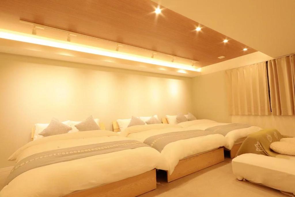 Ein Bett oder Betten in einem Zimmer der Unterkunft 森下小屋