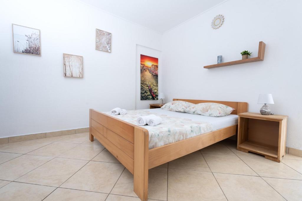 Postel nebo postele na pokoji v ubytování Apartments Vrabac