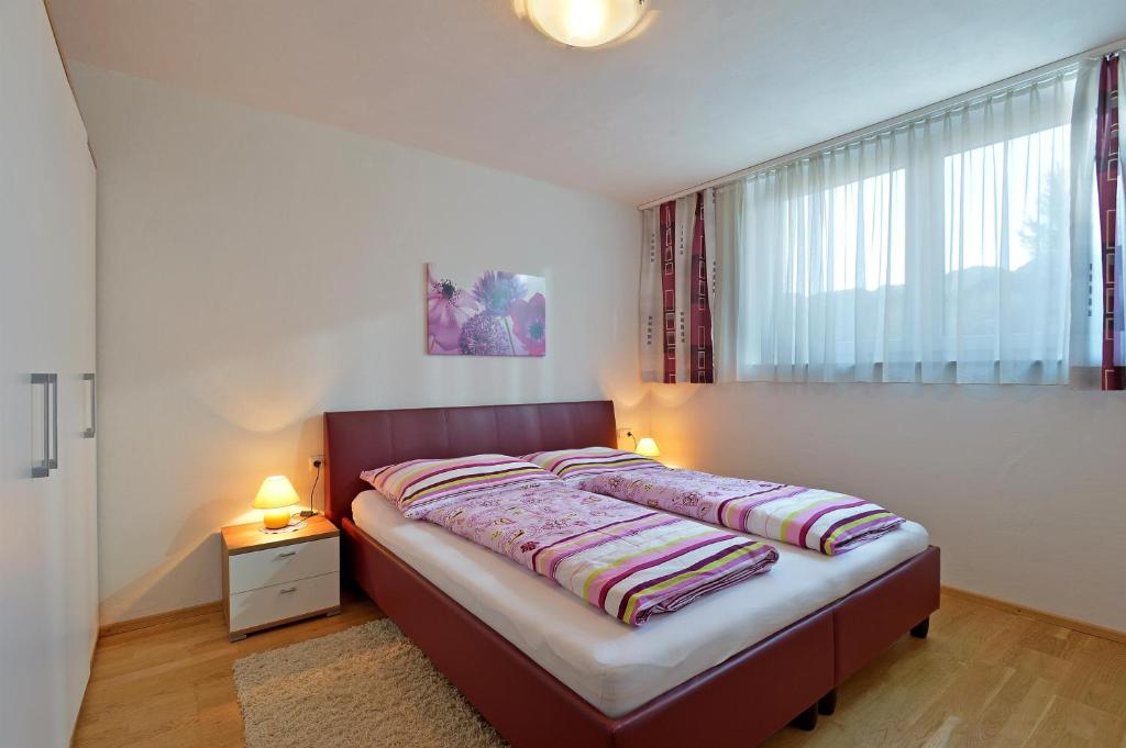 Postel nebo postele na pokoji v ubytování Alpenchalets Wilder Kaiser