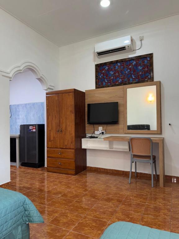 TV a/nebo společenská místnost v ubytování Cenang Room Rahsia Motel