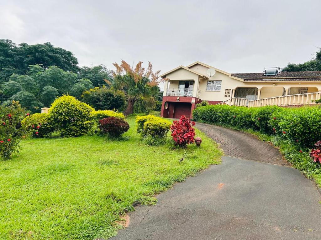 a house with a driveway in front of a yard at 692 Annet Drive in Durban