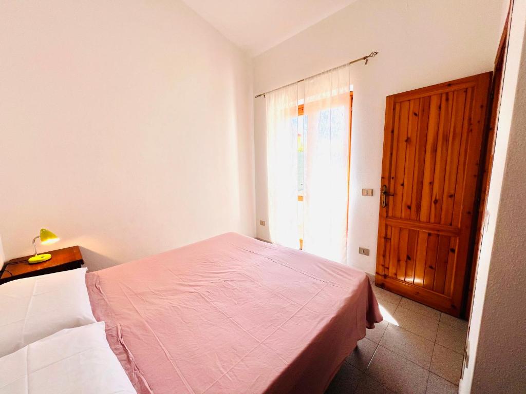 Łóżko lub łóżka w pokoju w obiekcie Residence La Cinta 8