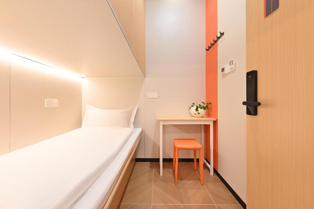 Postel nebo postele na pokoji v ubytování Beijing Xiaoding Hotel