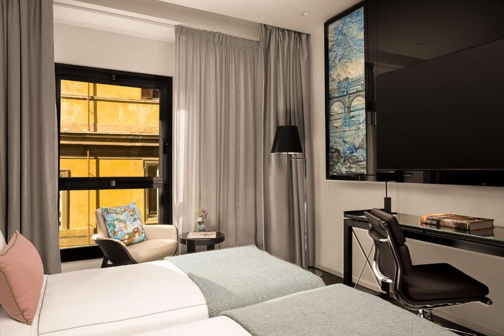 Postel nebo postele na pokoji v ubytování art'otel Rome Piazza Sallustio, Powered by Radisson Hotels