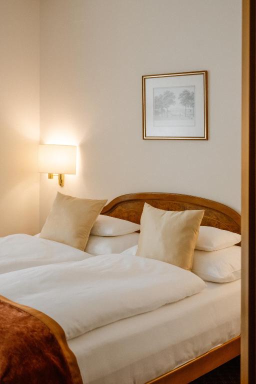 Postel nebo postele na pokoji v ubytování Hotel City Central