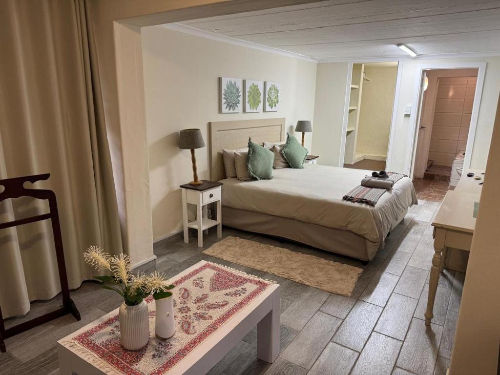 Ένα ή περισσότερα κρεβάτια σε δωμάτιο στο Florida Palms Guesthouse