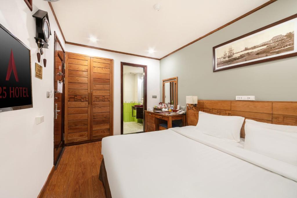 Postel nebo postele na pokoji v ubytování A25 Hotel - 45 Phan Chu Trinh