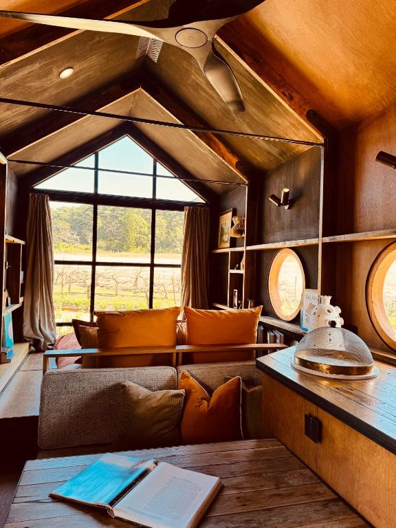a living room with a couch and a table at B Farm in Bobs Farm