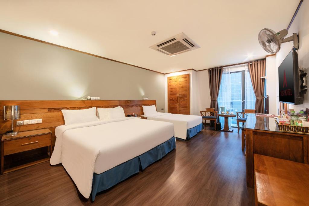 Postel nebo postele na pokoji v ubytování A25 Hotel - 45 Phan Chu Trinh