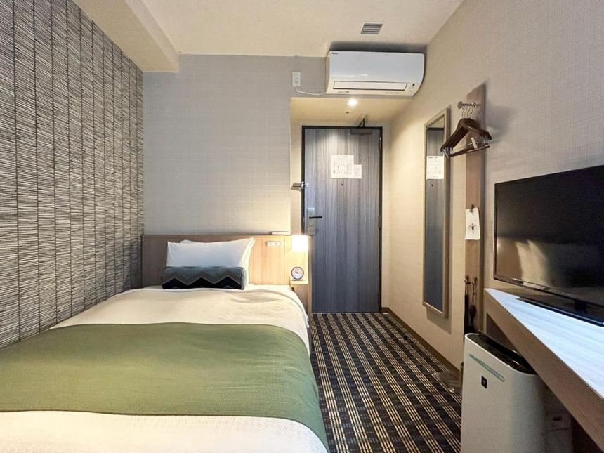 Postel nebo postele na pokoji v ubytování Garden Hotel Shizuoka