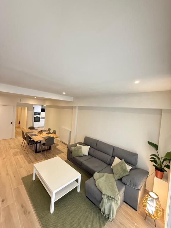 a living room with a couch and a table at Casa Dolce Casa in Valencia