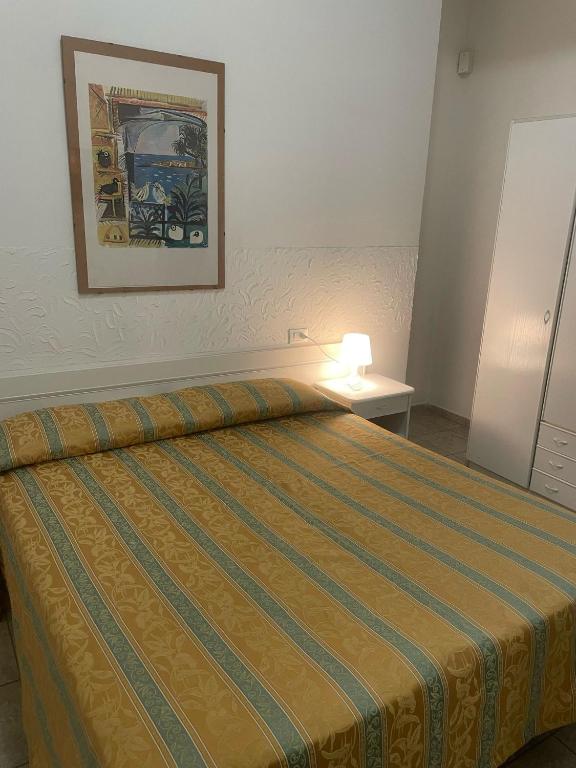Postel nebo postele na pokoji v ubytování Hotel Zeus
