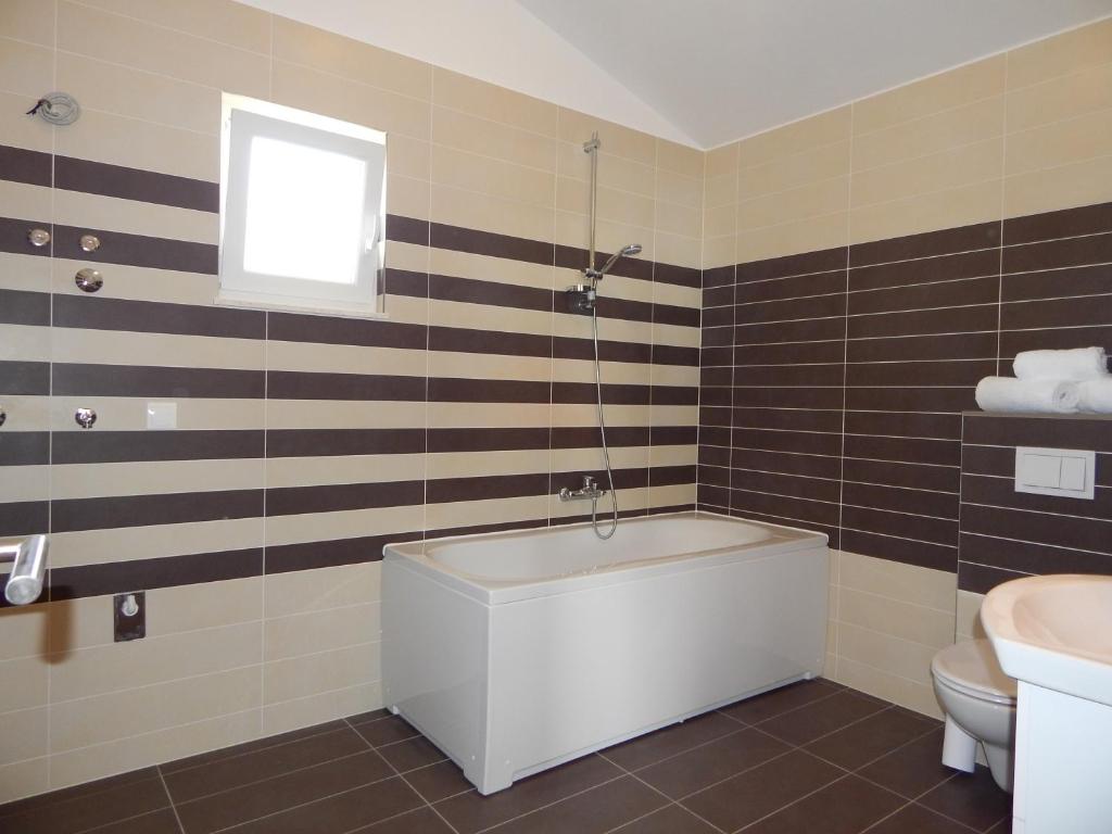 Kúpeľňa v ubytovaní Apartments King