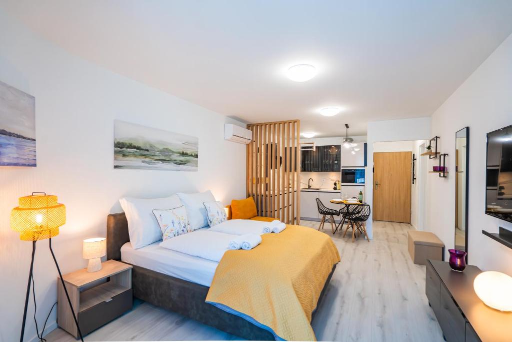 Et tv og/eller underholdning på MyFlat Wave Beach43 Apartment