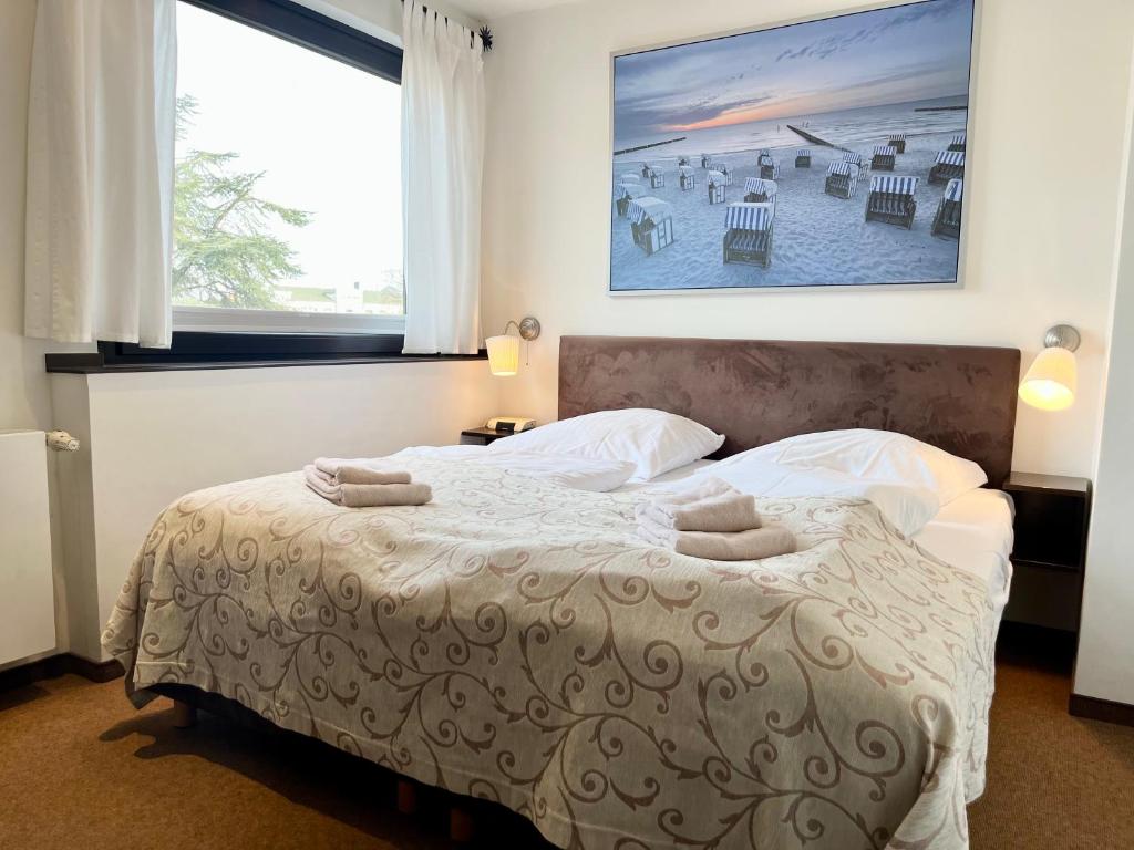 Ένα ή περισσότερα κρεβάτια σε δωμάτιο στο Appartementhaus Seemöwe Silbermöwe