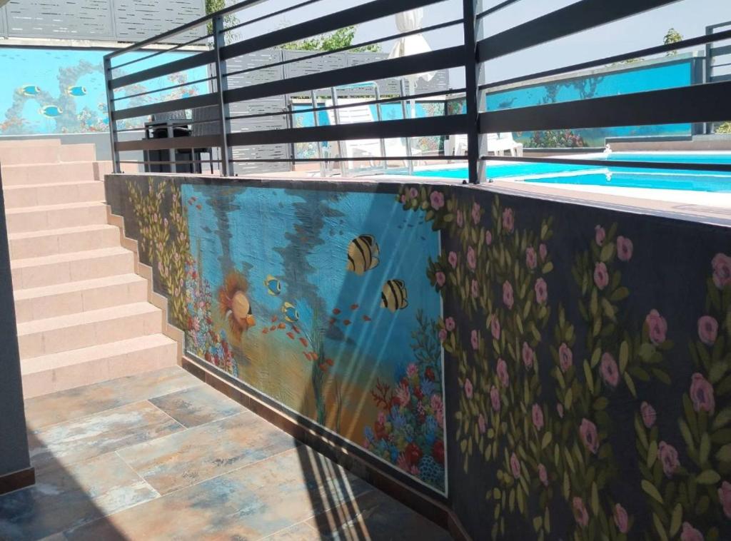 a swimming pool with a mural on the wall at Holiday Home Martin in Varaždinske Toplice