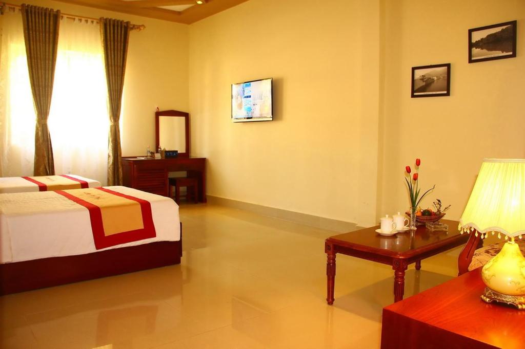 Postel nebo postele na pokoji v ubytování Phu Van Resort & Spa Phu Quoc