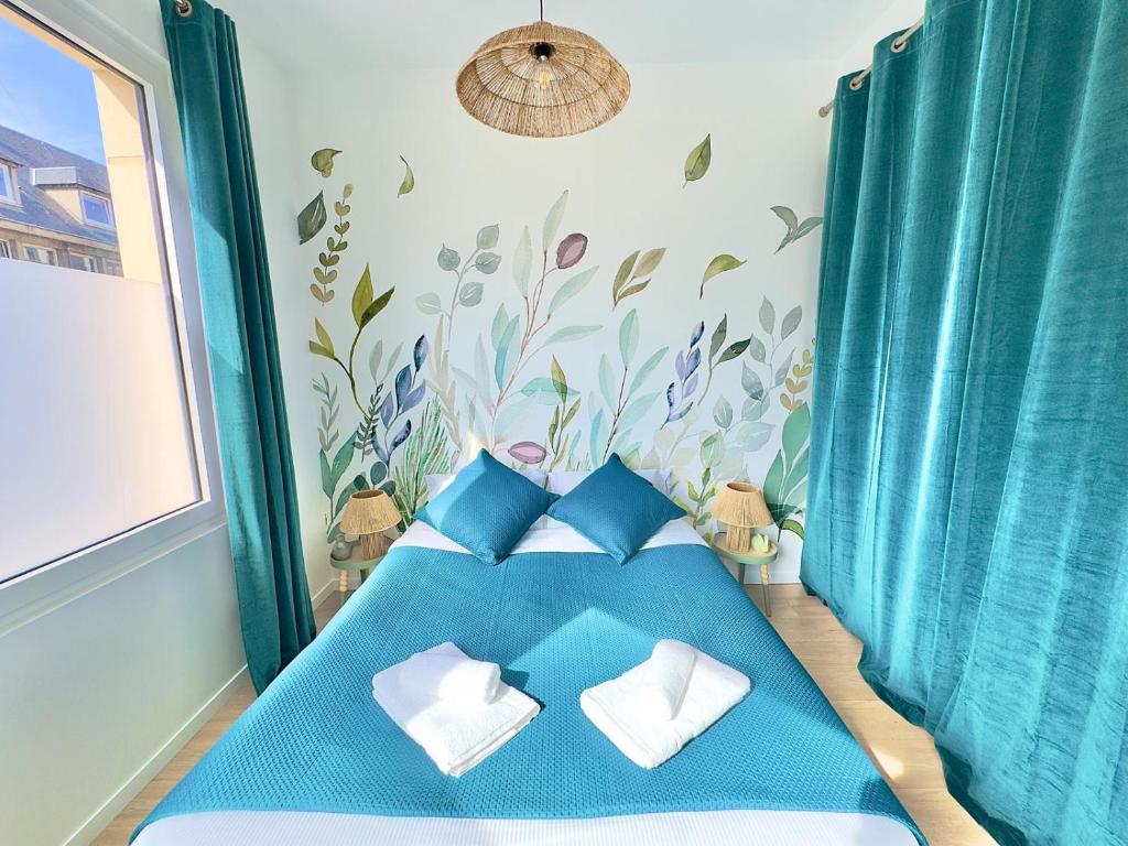 Ένα ή περισσότερα κρεβάτια σε δωμάτιο στο T2 Cosy Centre Ville Amiens - Rez-de-chaussée