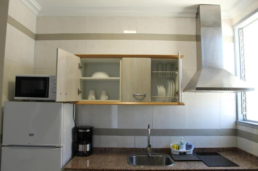 Kuchyň nebo kuchyňský kout v ubytování Apartamentos Fayna