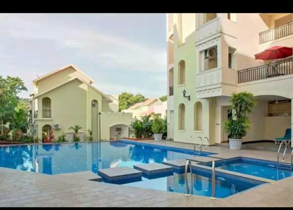 Πισίνα στο ή κοντά στο Tranquil 2BHK Serviced Apartment in Siolim