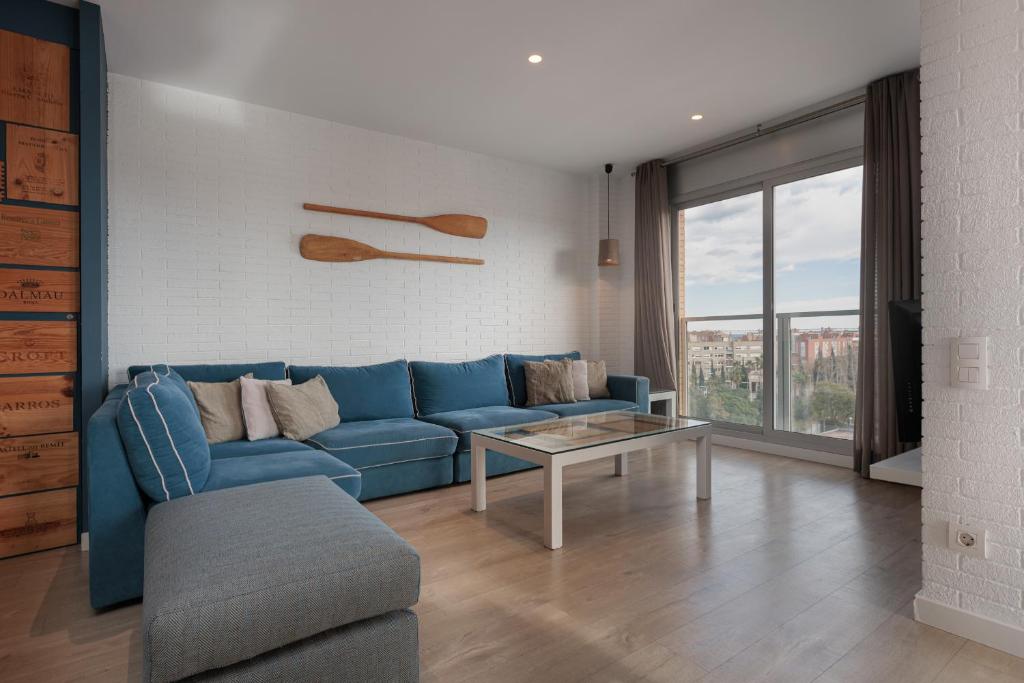 A seating area at Enjoybcn Marina Apartment
