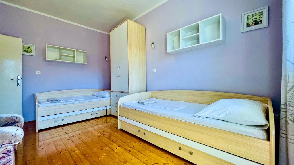 Postel nebo postele na pokoji v ubytování Apartments - Villa Sidro