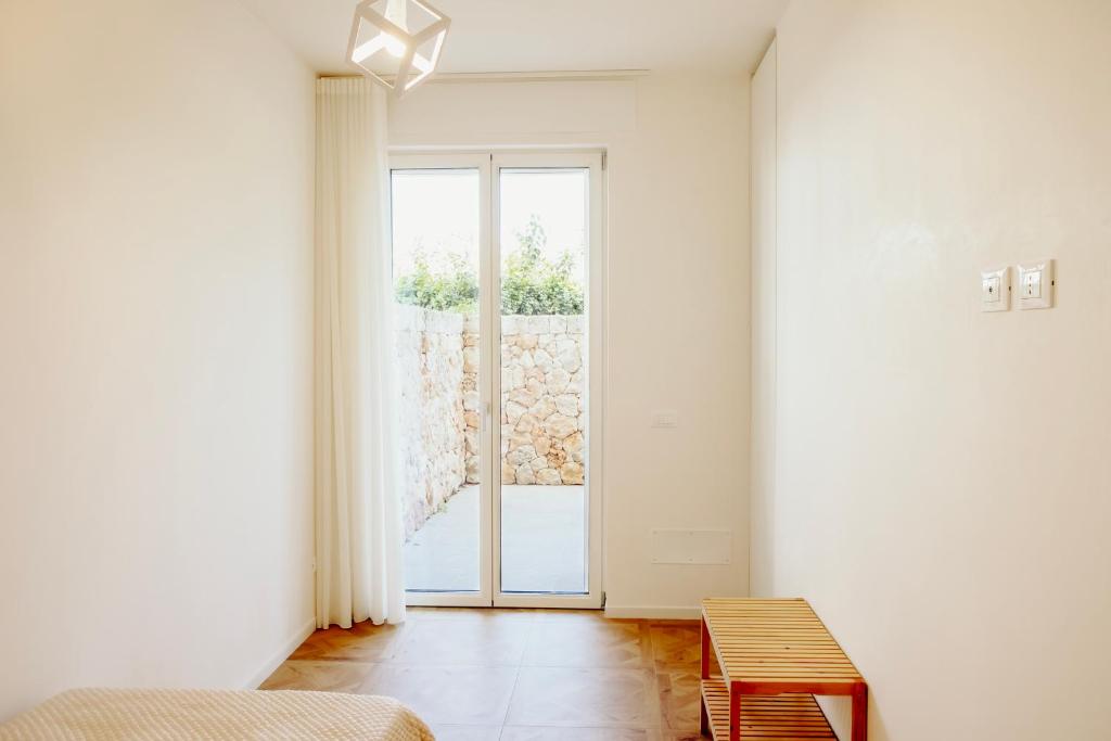 Postel nebo postele na pokoji v ubytování Venti D'Amare Suites