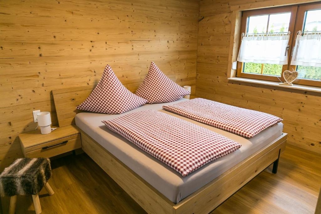 Postel nebo postele na pokoji v ubytování Chalet Hüttenzauber