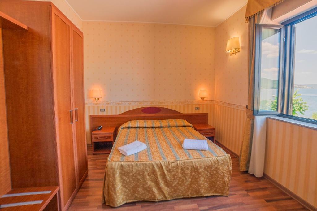 Postel nebo postele na pokoji v ubytování La Carrozza d'Oro