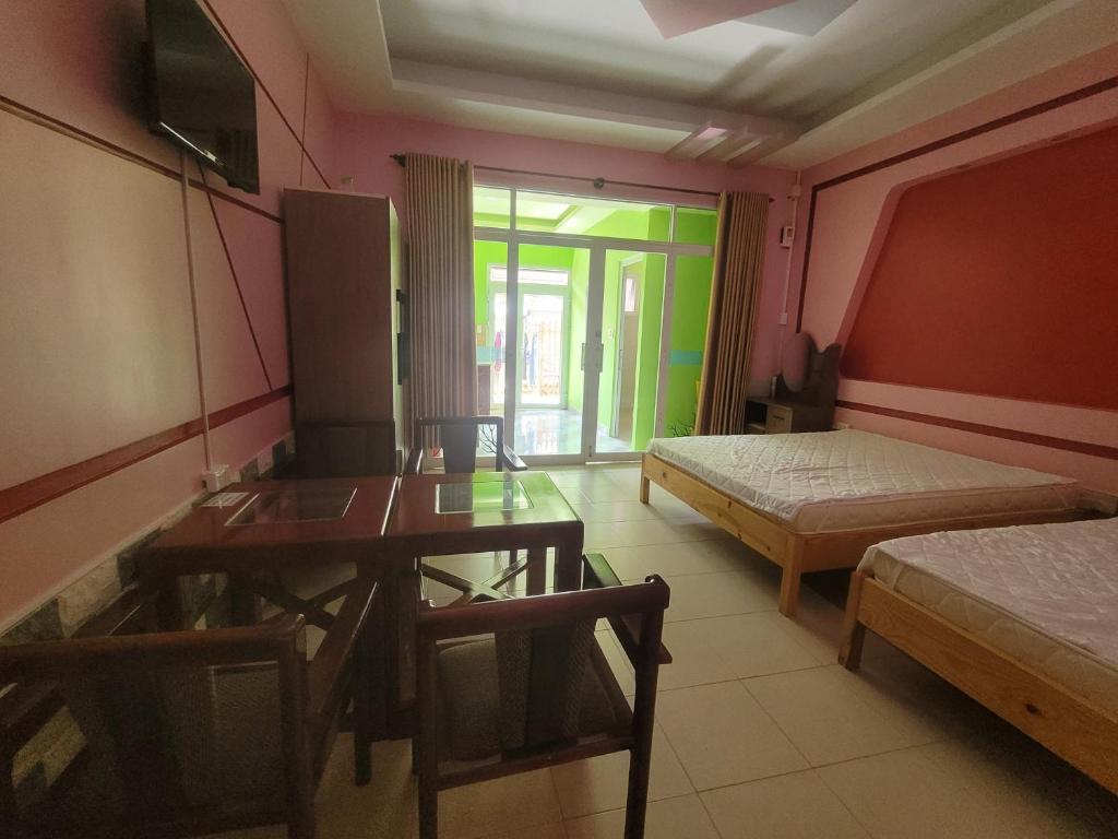 Postel nebo postele na pokoji v ubytování Vinh Phong APT # 1