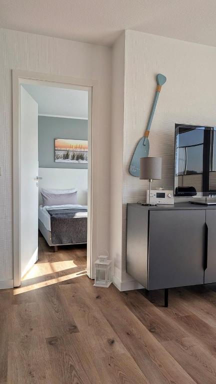 Postel nebo postele na pokoji v ubytování Ferienwohnung Lüttje Inselglück