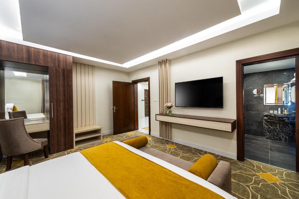 TV a/nebo společenská místnost v ubytování Garden Millennium Hotel