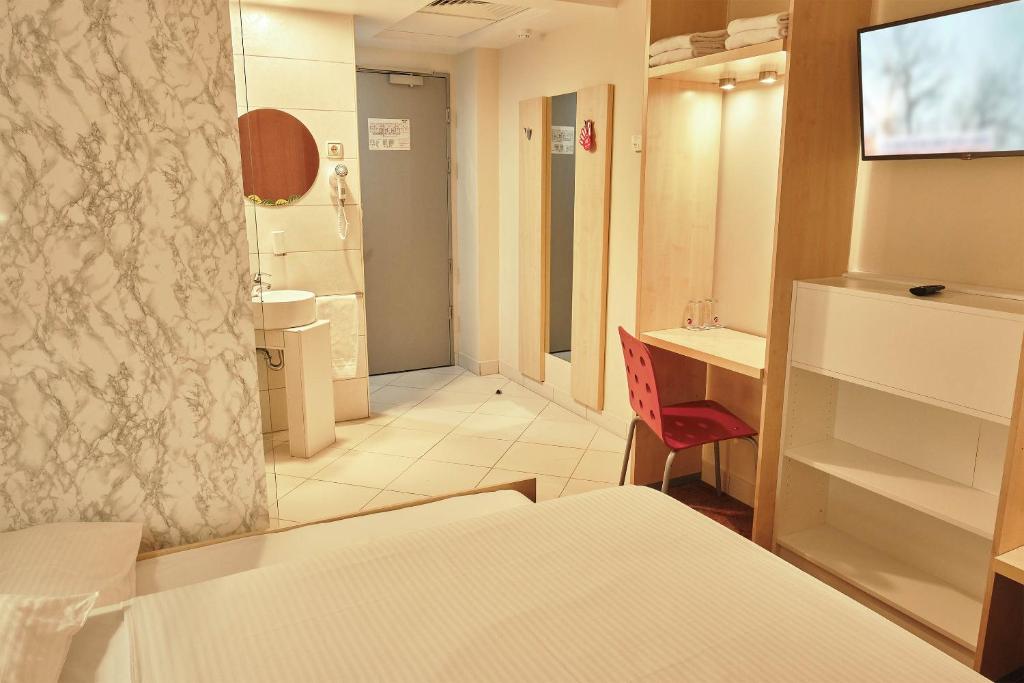 Postel nebo postele na pokoji v ubytování Hello Hotels Bucuresti Gara de Nord