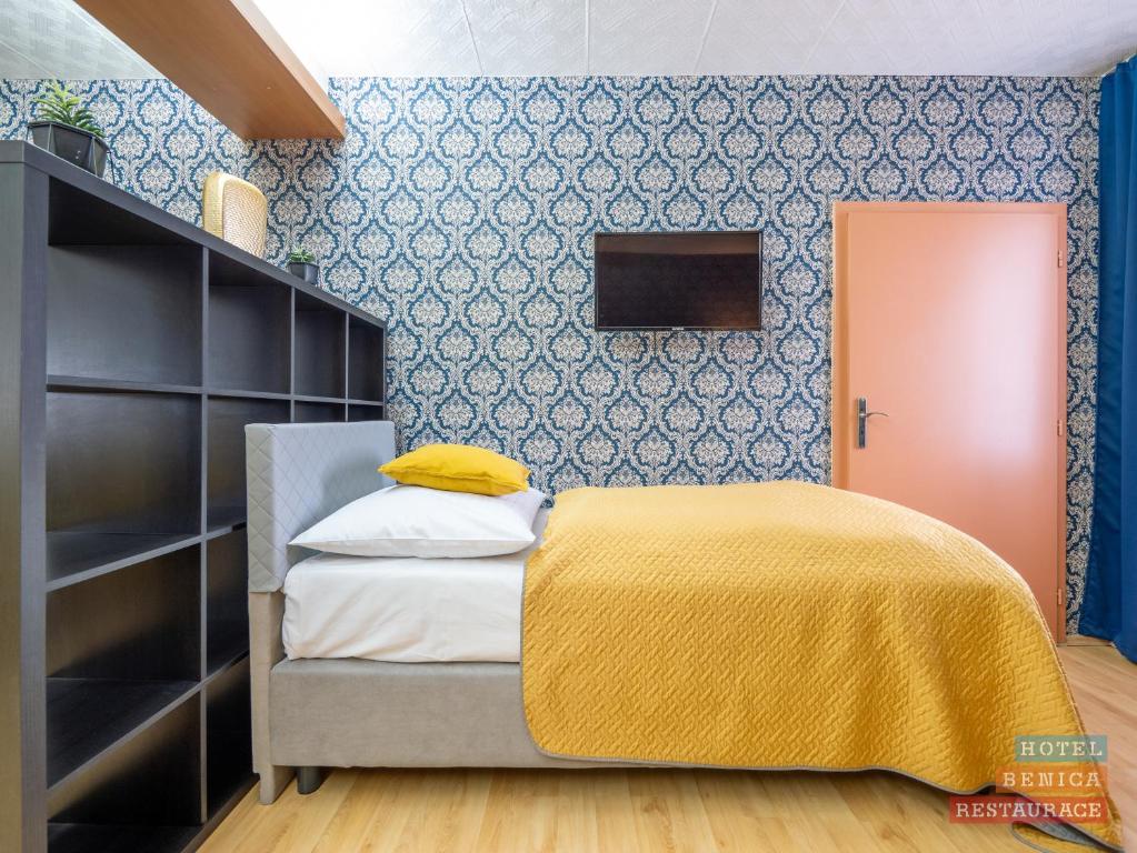 Cama o camas de una habitación en Hotel Benica