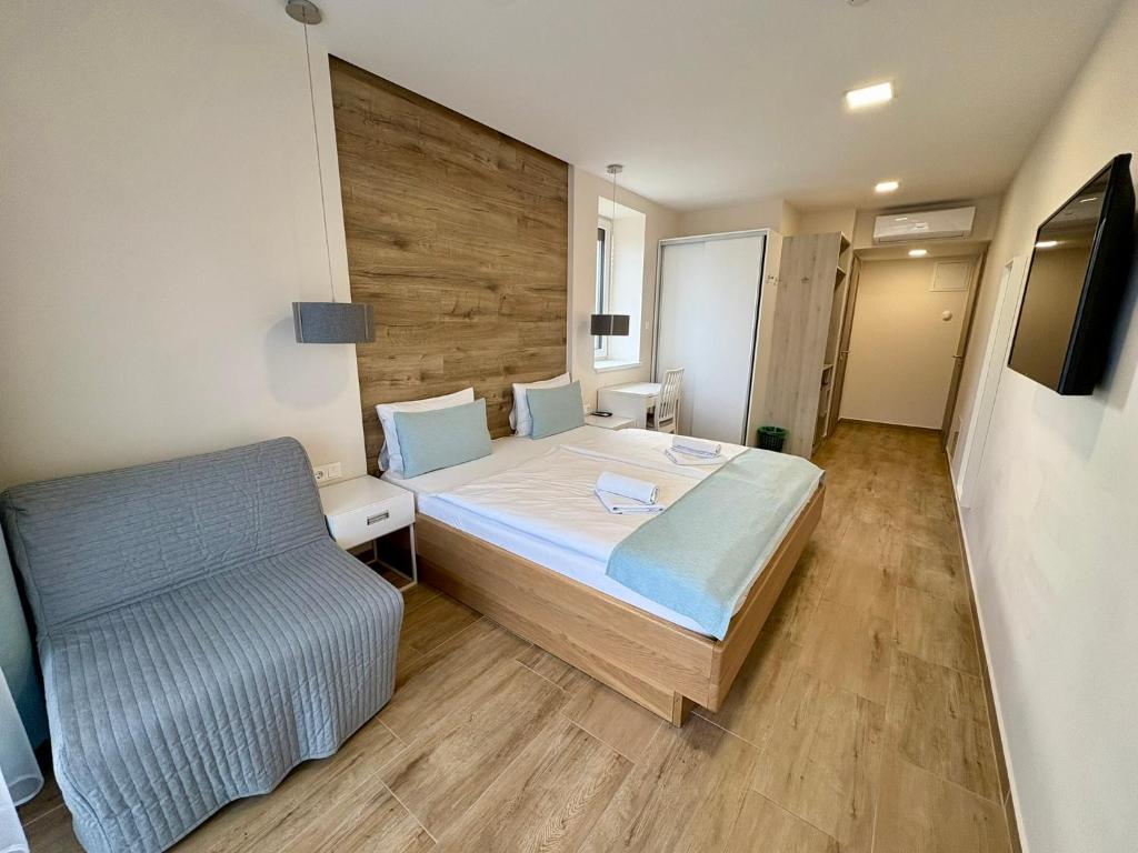 TV a/nebo společenská místnost v ubytování MAGNOLIA Room & Spa - ADULTS ONLY