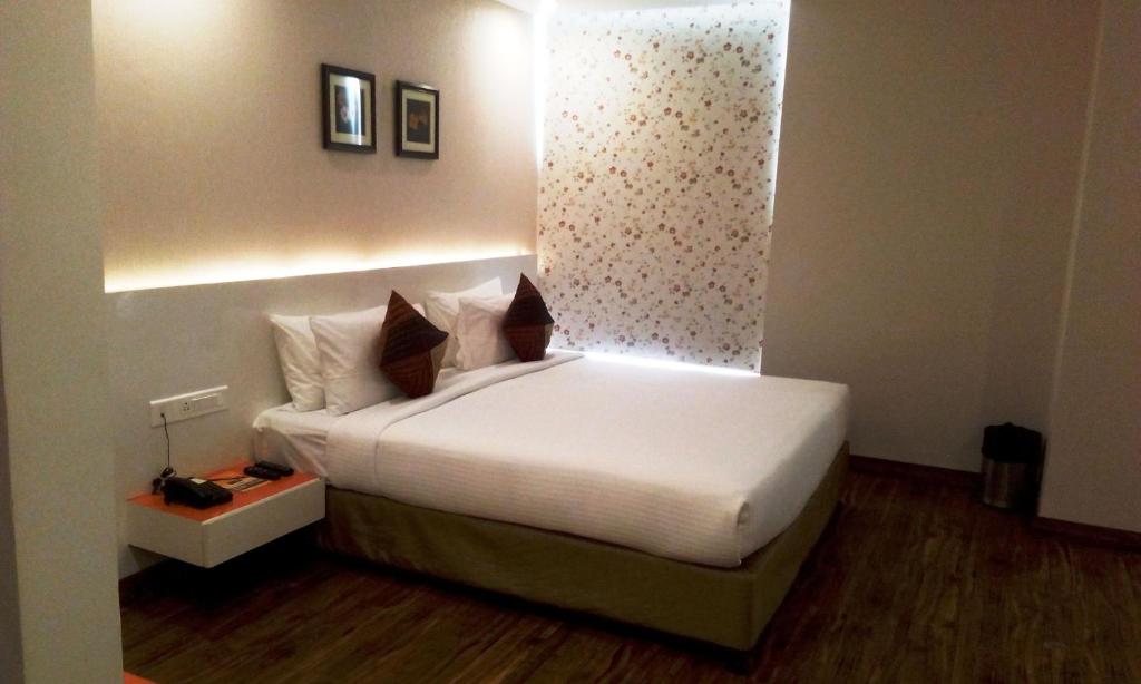 Postel nebo postele na pokoji v ubytování Mango Hotels Prangan