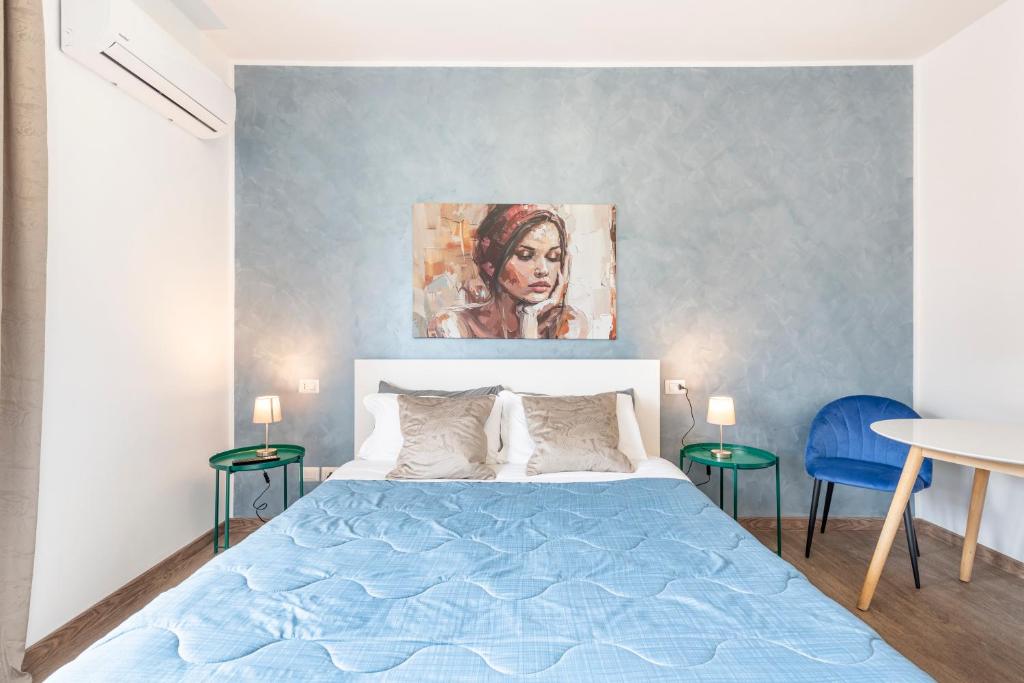 a bedroom with a bed and a painting on the wall at Bnb Drive In in Rome