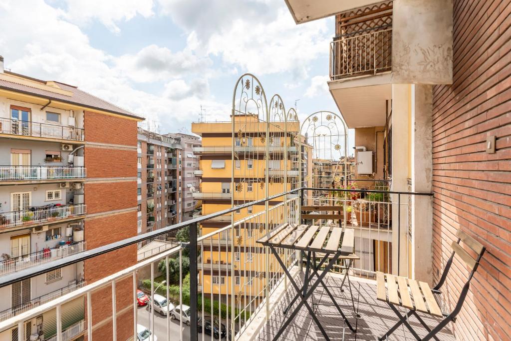a balcony with a bench and some buildings at Bnb Drive In in Rome