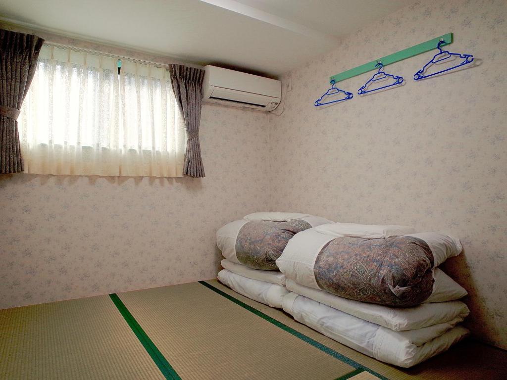 Postel nebo postele na pokoji v ubytování BJ family inn