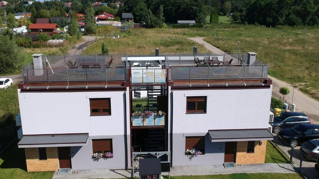an aerial view of a building with a balcony at Lavanda Apartamenty in Chłopy