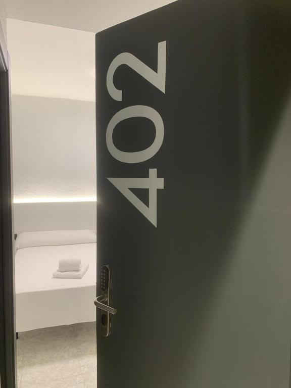 Postel nebo postele na pokoji v ubytování Hotel DL Urban