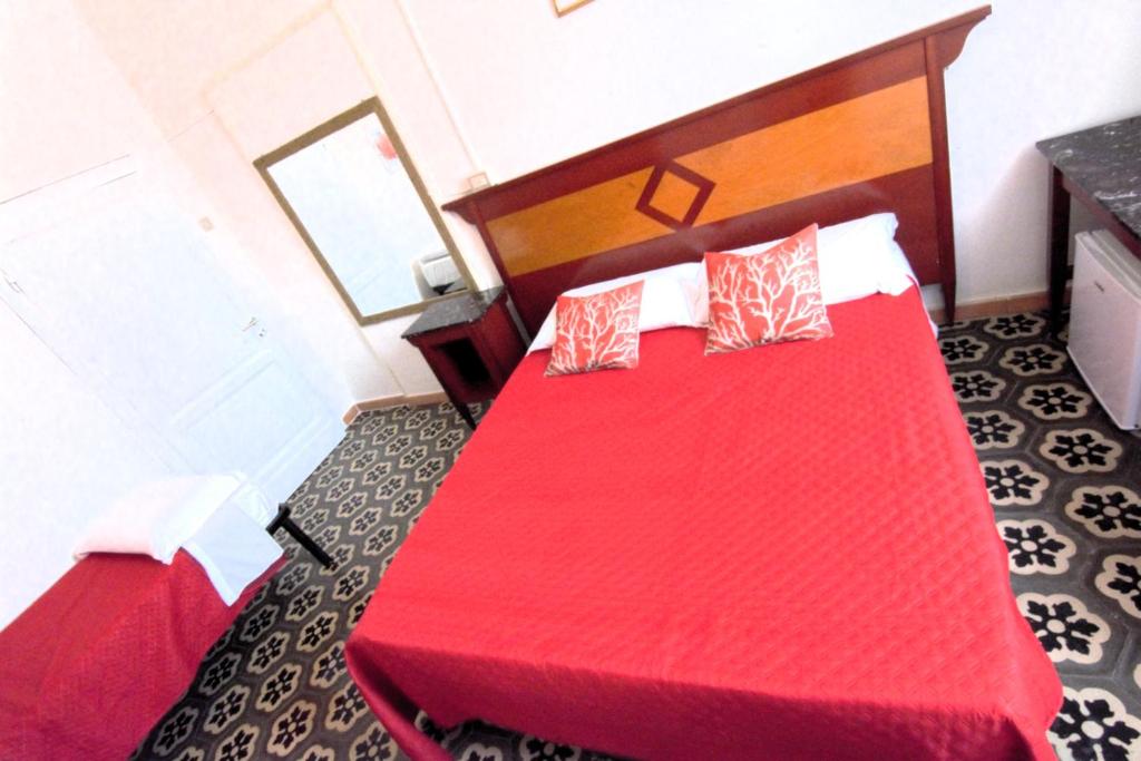 Postel nebo postele na pokoji v ubytování Hotel Corallo Follonica