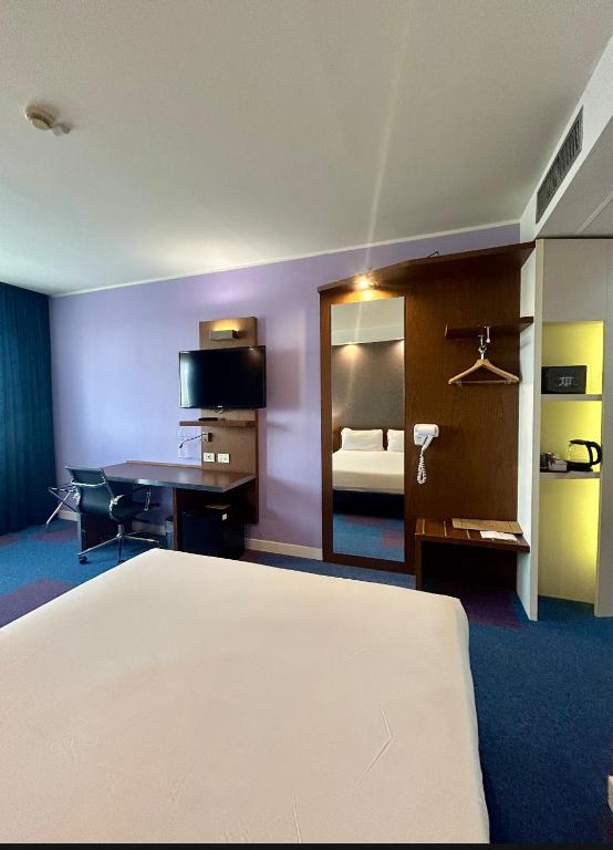 Posteľ alebo postele v izbe v ubytovaní GP Hotel