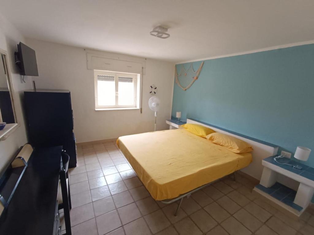Posteľ alebo postele v izbe v ubytovaní La casa di Clelia Torre colimena porto cesareo salento esclusiva 2 piani con 6 camere doppie 3 bagni posti auto terrazza giardino 5 minuti dal mare