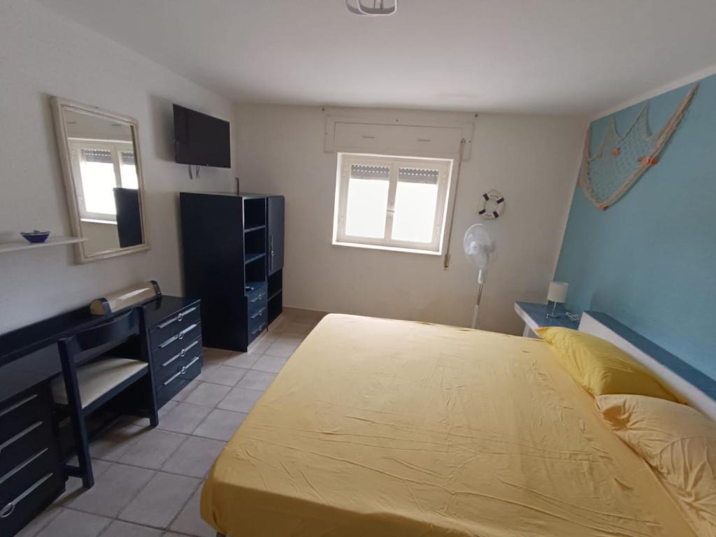 Posteľ alebo postele v izbe v ubytovaní La casa di Clelia Torre colimena porto cesareo salento esclusiva 2 piani con 6 camere doppie 3 bagni posti auto terrazza giardino 5 minuti dal mare