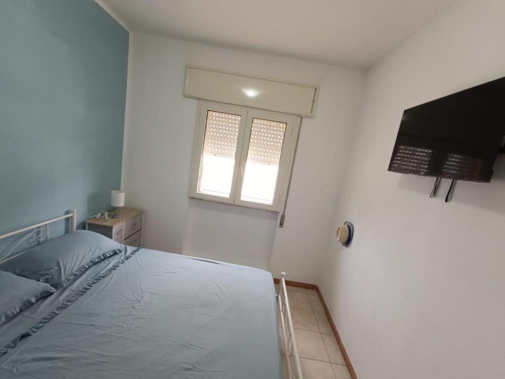 Posteľ alebo postele v izbe v ubytovaní La casa di Clelia Torre colimena porto cesareo salento esclusiva 2 piani con 6 camere doppie 3 bagni posti auto terrazza giardino 5 minuti dal mare