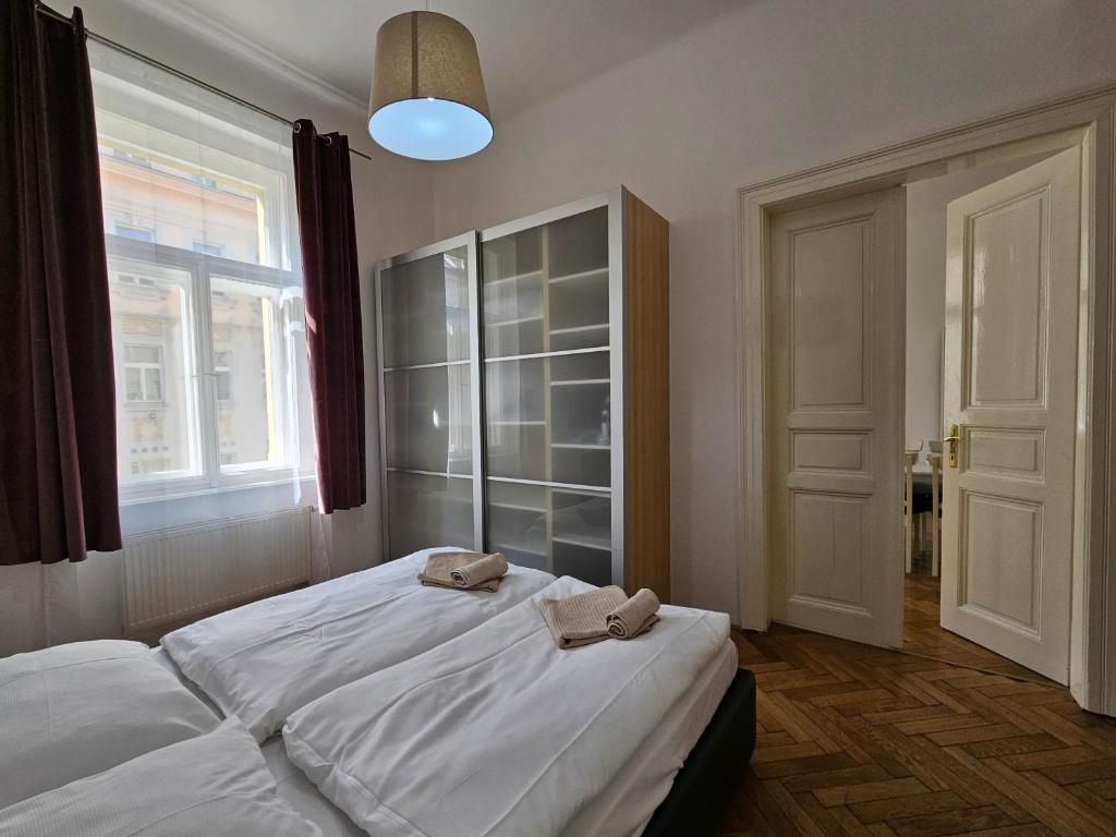 Postel nebo postele na pokoji v ubytování Slezska Apartments