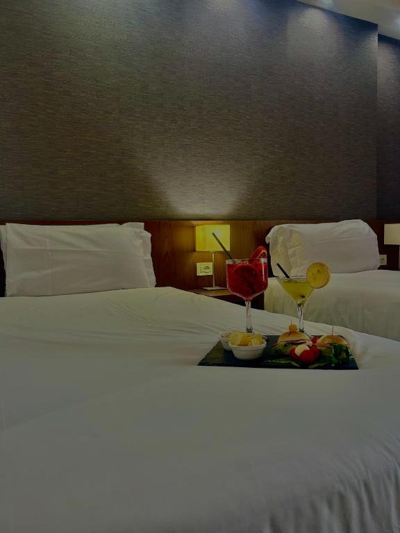 Posteľ alebo postele v izbe v ubytovaní GP Hotel